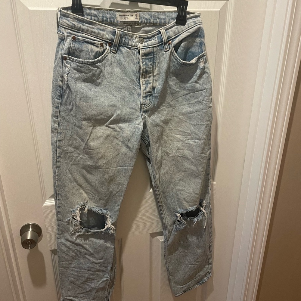 Womans Light Blue Distressed Jeans. High rise